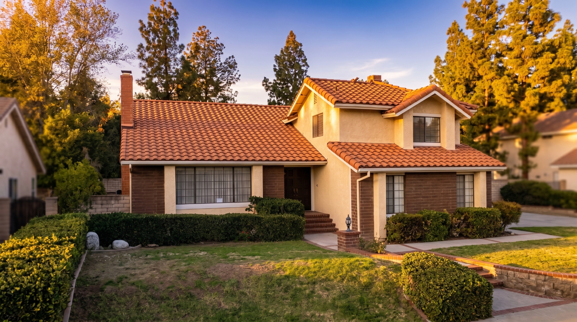 Luxury home with premium roofing at golden hour